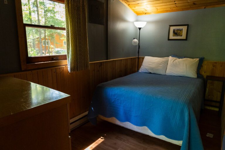 Cottage bedroom with wainscotting