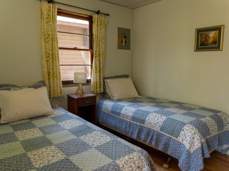 Two single beds in cottage bedroom