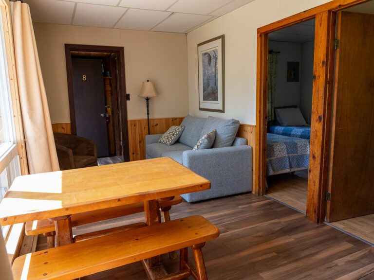 View by kitchen table looking towards two doorways