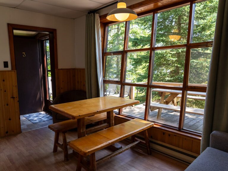 table beside floor-to-ceiling window