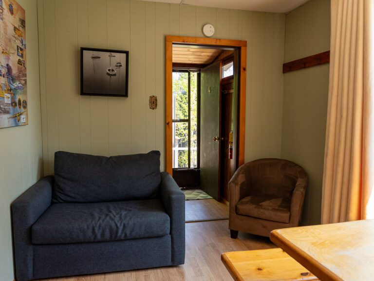 View of armchair and door to outside