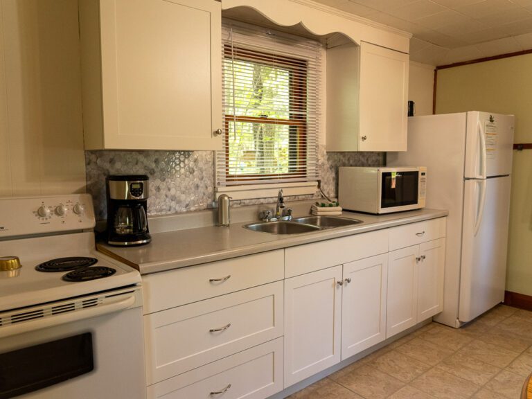 Interior of cottage kitchen, with window over the sink