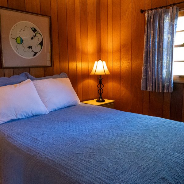 BBM09858_Cottage-5 Bedroom with world map above the bed and glowing bedside lamp