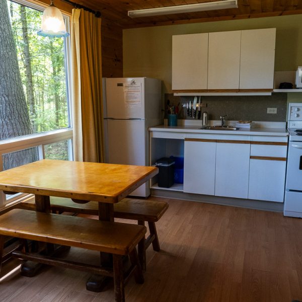 BBM09891_Cottage-6 Cottage kitchen with wooden table by the window